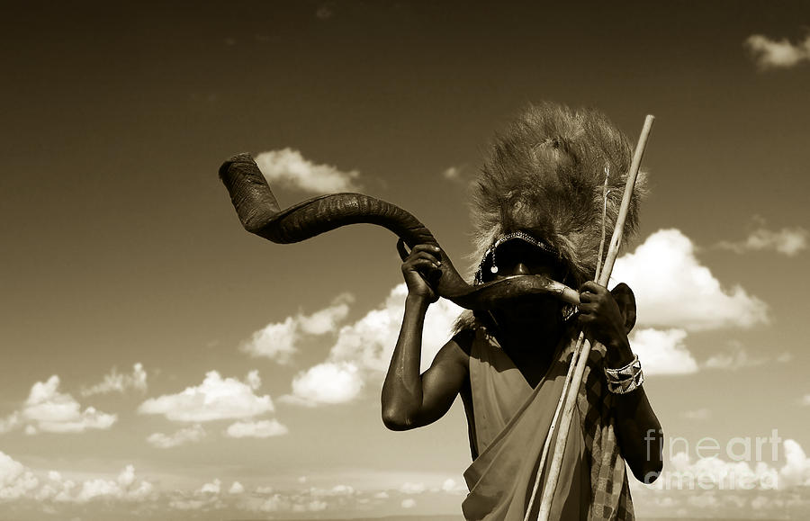 Masai warrior playing traditional horn Photograph by Anna Om