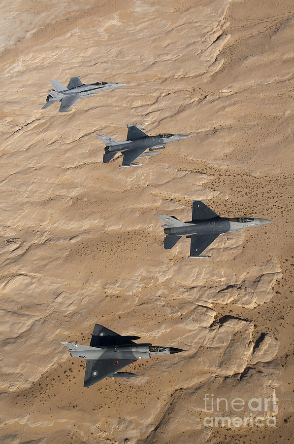 Airplane Photograph - Military Fighter Jets Fly In Formation by Stocktrek Images