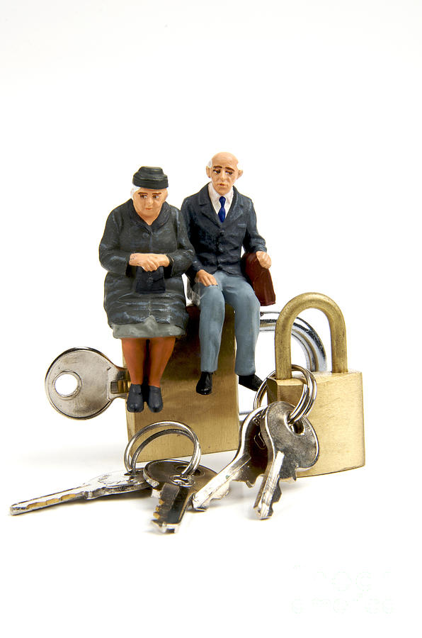 Key Photograph - Miniature figurines of elderly couple sitting on padlocks by Bernard Jaubert