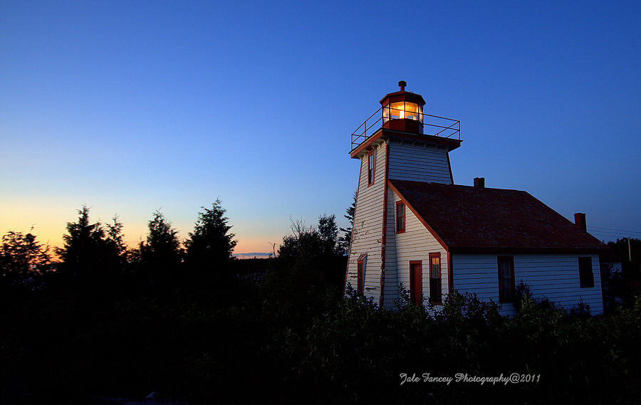 Mississagi Lighthouse after sunset Photograph by Jale Fancey