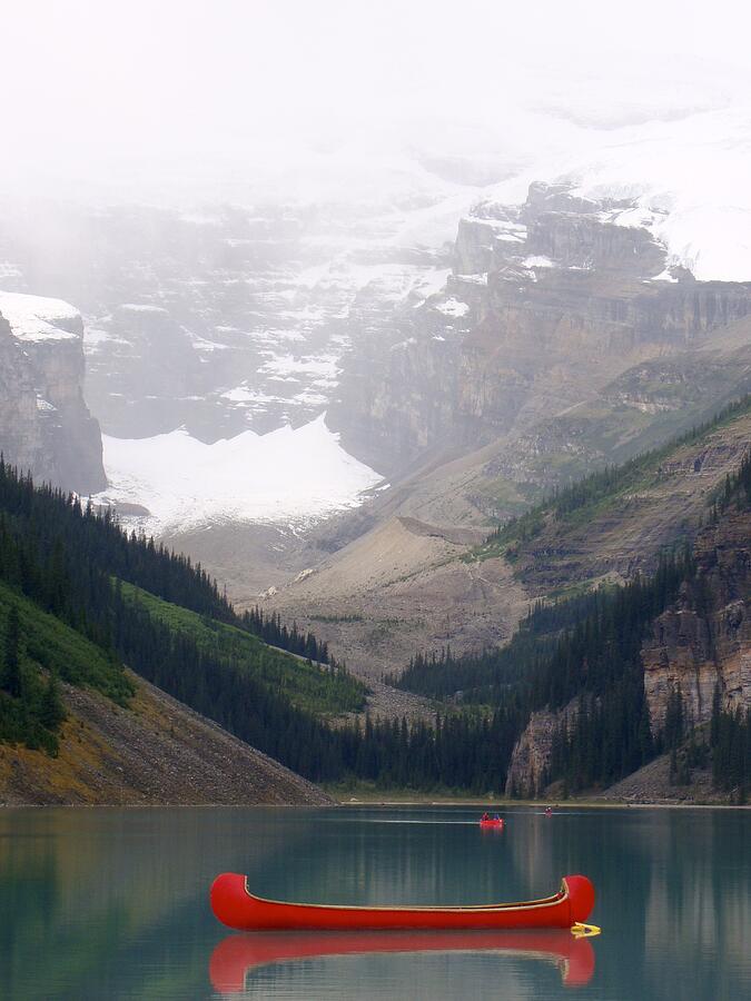 Misty Canoe Paddle - Lake Louise - Banff National Park, Alberta Photograph by Ian McAdie