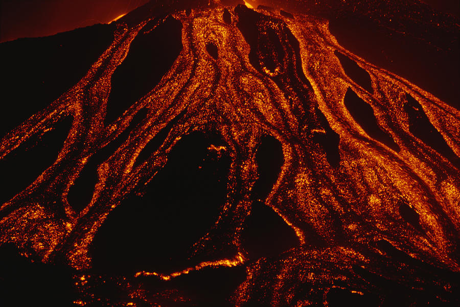 Molten Lava Flows Down A Volcanic Slope Photograph by Carsten Peter