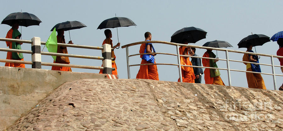 Monks With Umbrellas Photograph by Bob Christopher