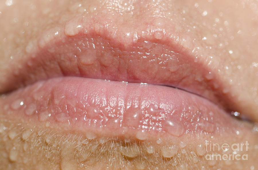Mouth with water drops Photograph by Mats Silvan
