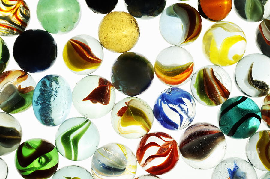 Multi-colored marbles Photograph by Sami Sarkis