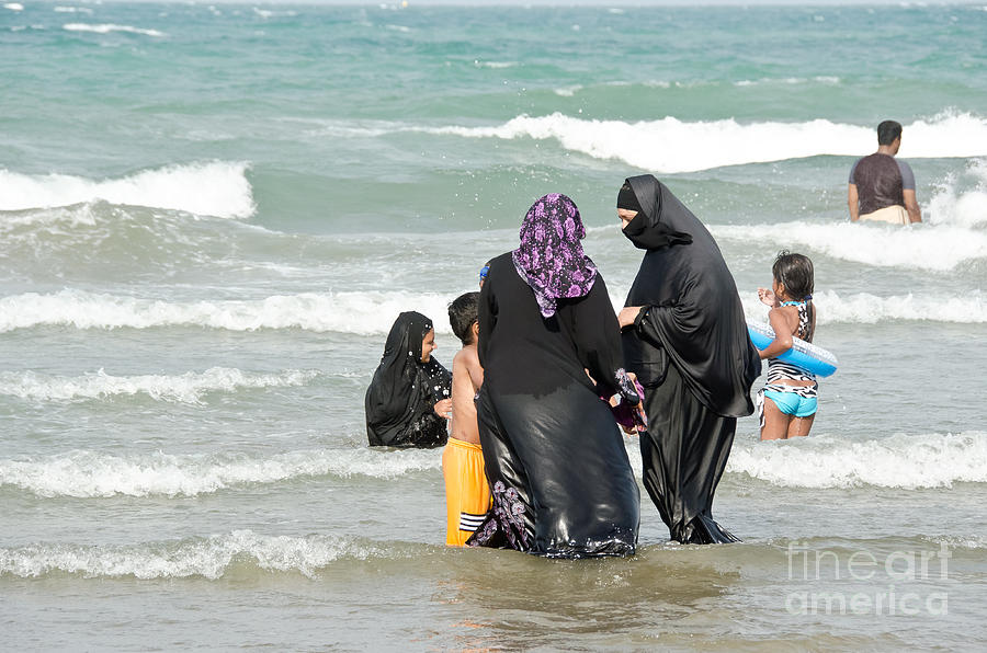Muslim Family Swimming Photograph by Yurix Sardinelly