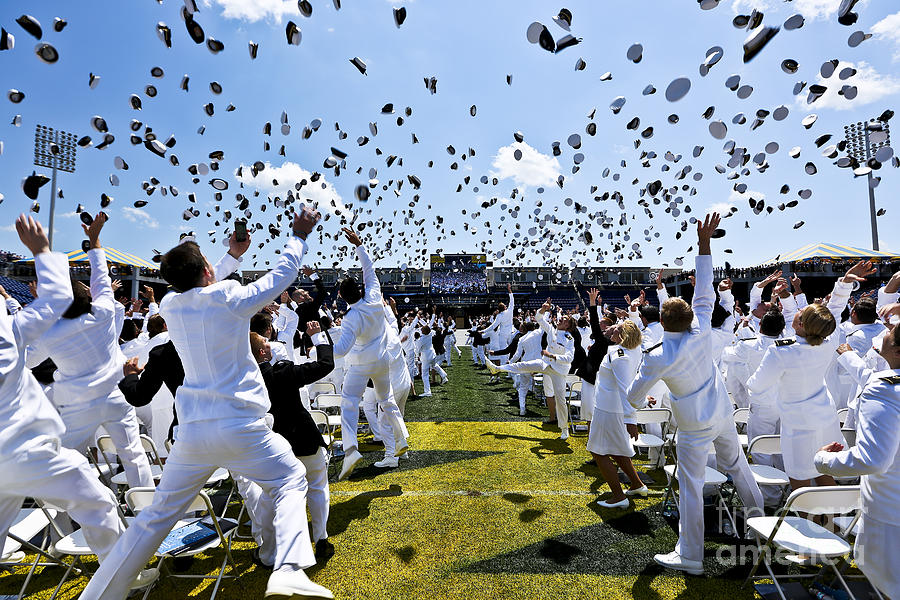 Naval Academy grads toss hats