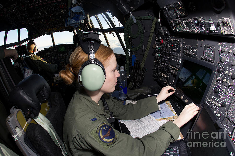 Transportation Photograph - Navigator At Work In A Mc-130p Combat by Gert Kromhout