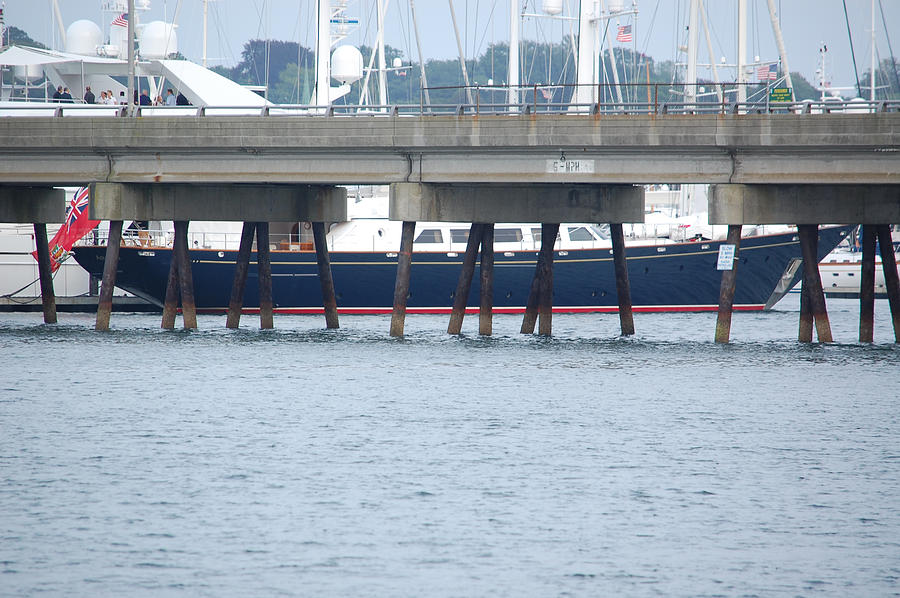 Newport RI Sailboat Through Pilings Photograph by Mary McAvoy