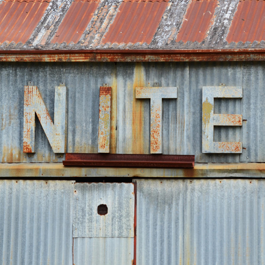NITE Rusty Metal Sign Photograph by Nikki Smith