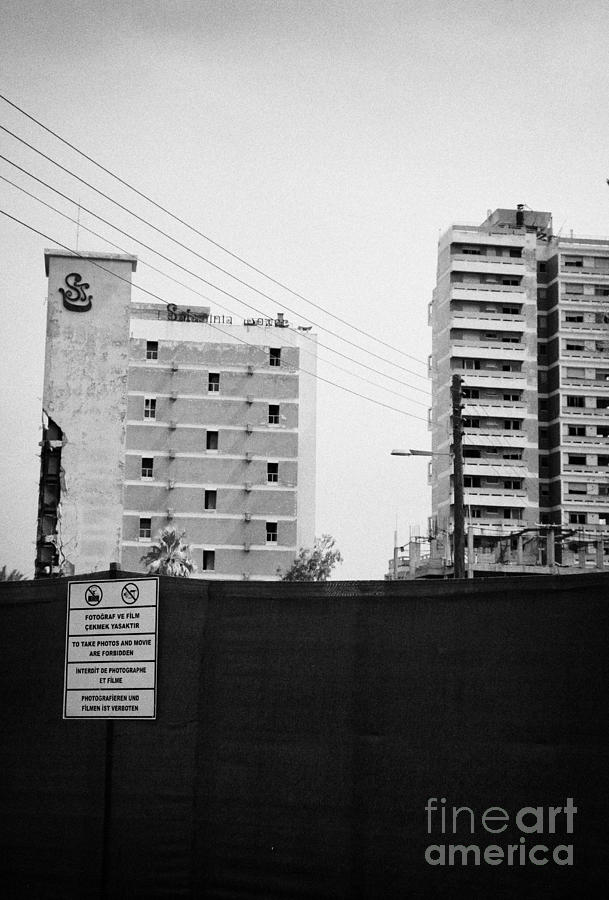 Sign Photograph - No Photography Warning Signs At Varosha Forbidden Zone With Salaminia Tower Hotel Abandoned In 1974 by Joe Fox