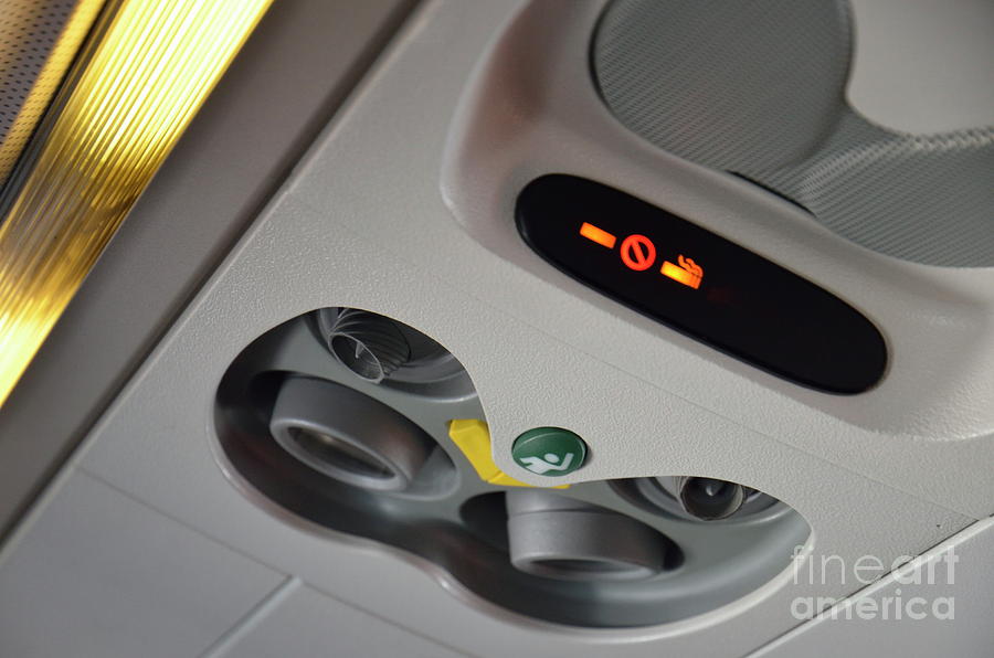 No smoking signs in airplane Photograph by Sami Sarkis