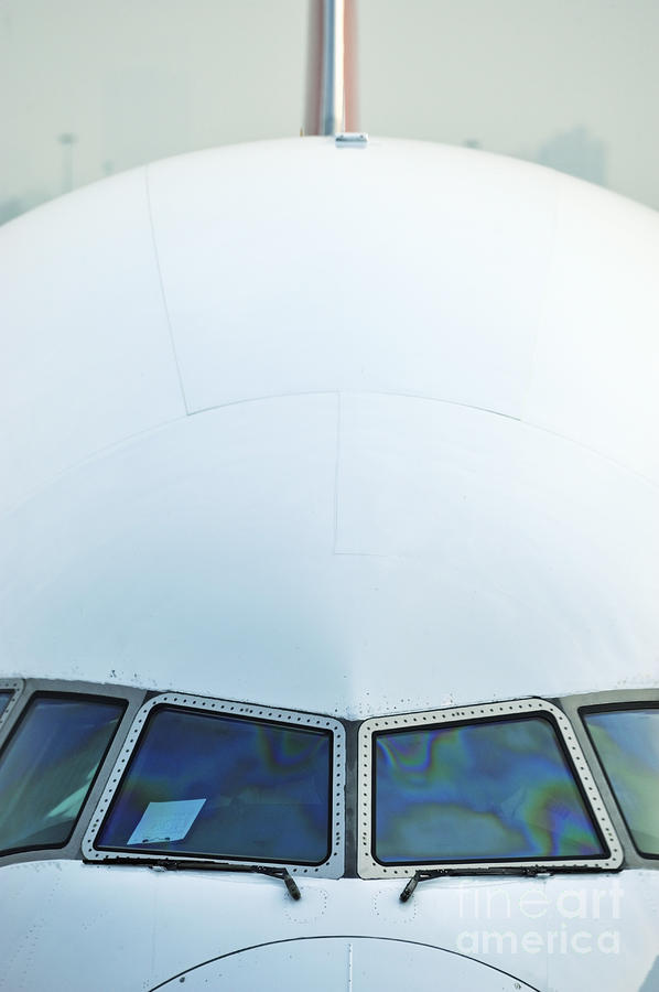 Transportation Photograph - Nose of a commercial airplane by Sami Sarkis