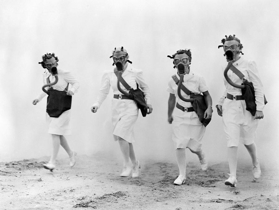 Nurses In Gas Masks Walk Photograph by Everett - Fine Art America