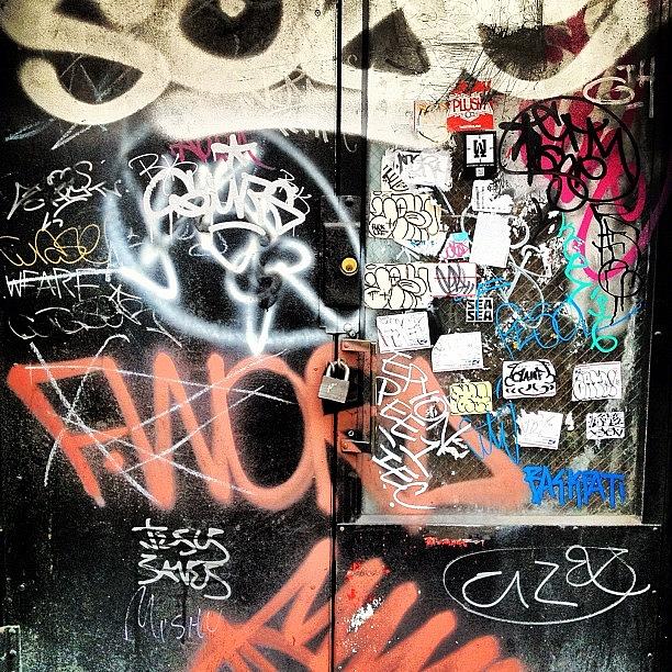 New York City Photograph - Nyc Graffiti Stickers Door by Nick Valenzuela