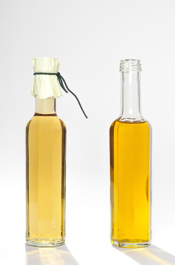 Oil and vinegar bottles Photograph by Matthias Hauser