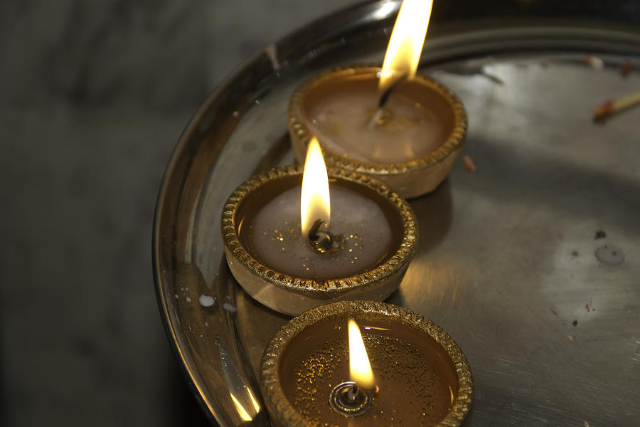 Oil lamps kept in a plate as part of Diwali celebrations Photograph by Ashish Agarwal