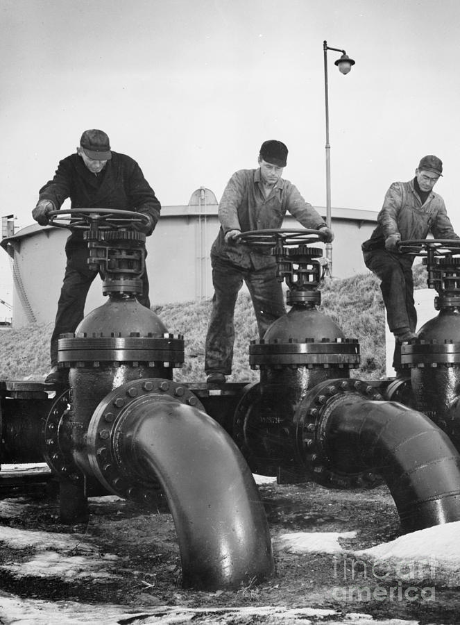 OIL VALVES, c1944 Photograph by Granger