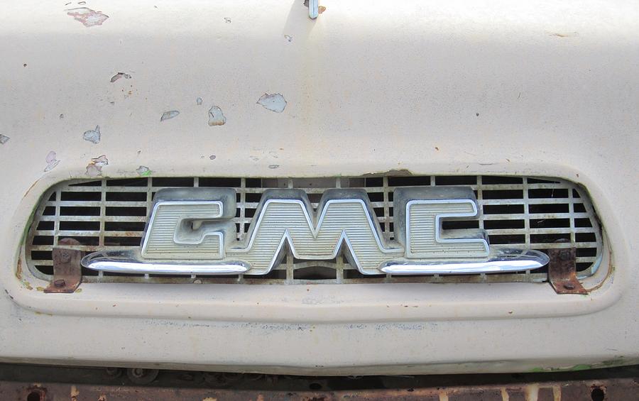 Vintage Photograph - Old GMC truck logo by Yianni Foufas