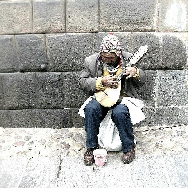 Brick Photograph - #old #man Playing #music In #cuzco #peru by Yannick Menard