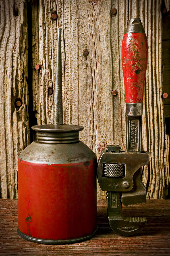 Old oil can and wrench Photograph by Garry Gay