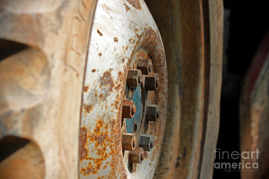 Old Tractor Wheel Photograph by Todd Blanchard