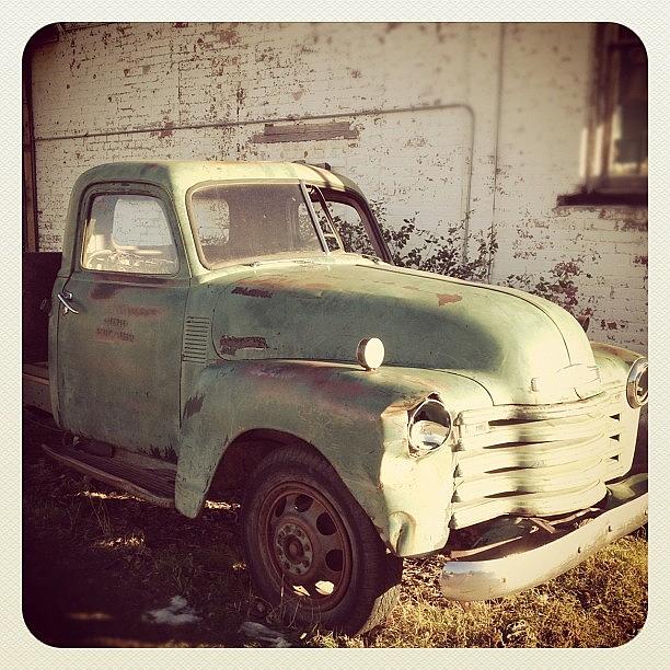 Old Truck By The Feed & Grain Photograph by Jason Rohlf