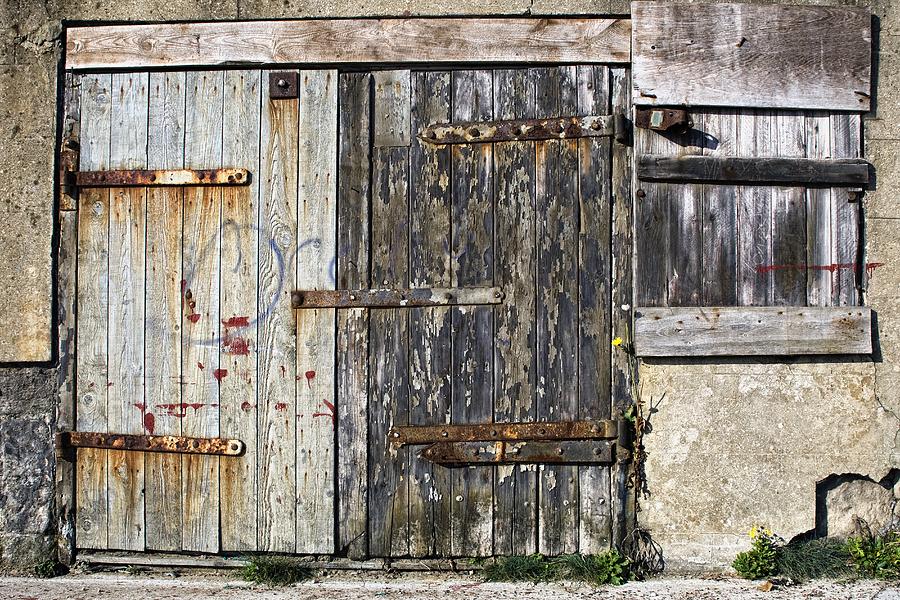 Architecture Photograph - Old Wooden Door Of Building by John Short