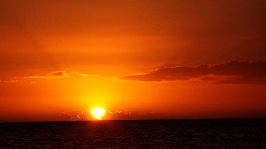 Orange Ball Setting on the Ocean in Oahu Photograph by Gwenn Dunlap ...