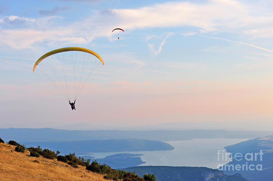 Sunset Photograph - Paragliders flying at sunset by Sami Sarkis