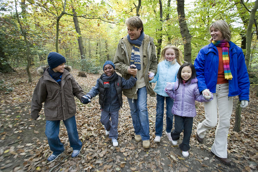 Fall Photograph - Parents And Children Walking In A Wood by Ian Boddy