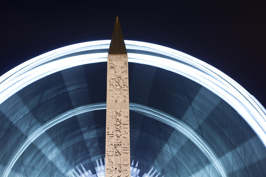 Paris Photograph - Paris Champs Elysees Obelisk and ferris wheel of La Concorde at night close up by Mao Xiangchang