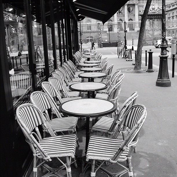 Paris Photograph - Parisian. A Cafe Next To Notre Dame by Shafik Ismail