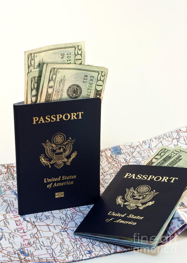 Transportation Photograph - Passports with map and money by Blink Images