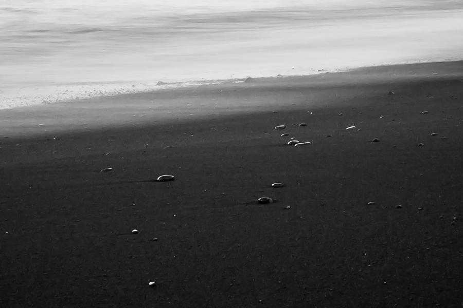 Pebbles on a Black Sand Beach Photograph by Anthony Doudt