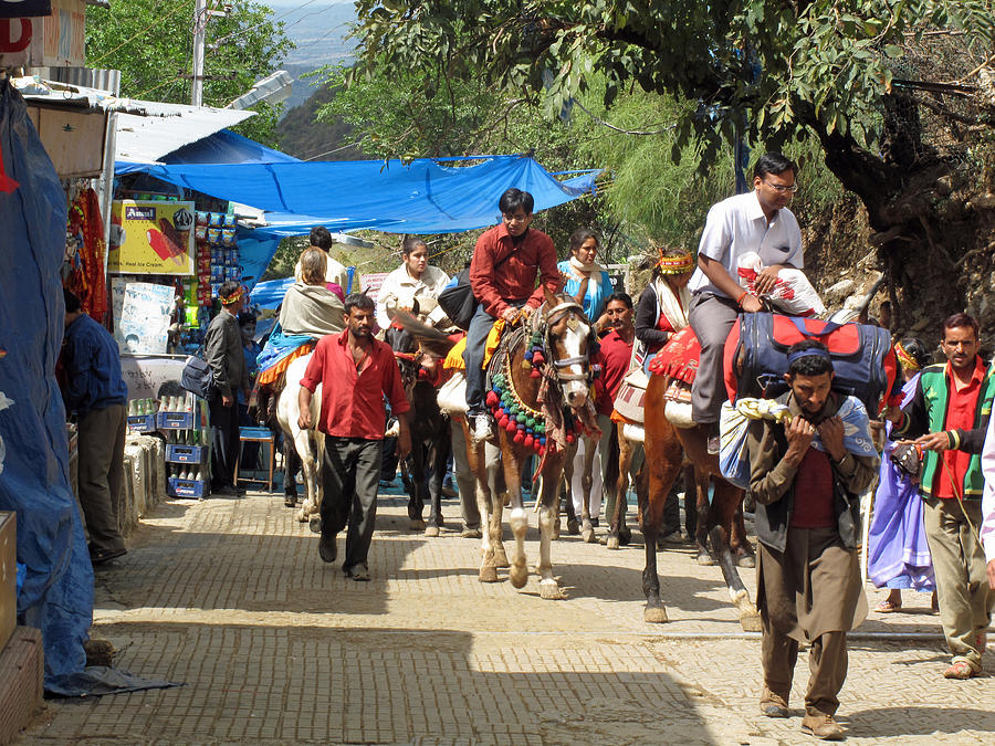Horse Photograph - People on horseback and on foot making the climb to the Vaishno Devi Shrine in India by Ashish Agarwal
