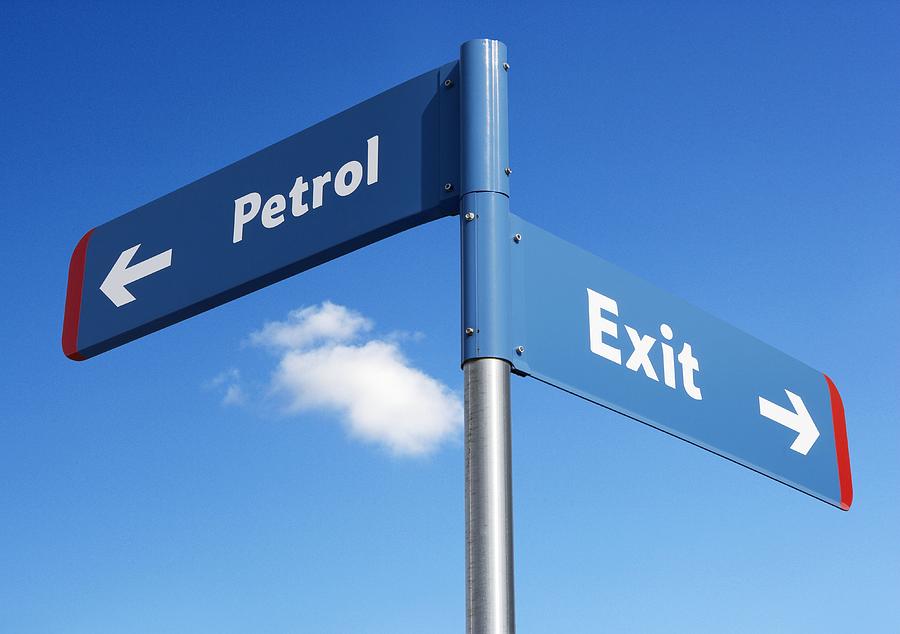 Sign Photograph - Petrol And Exit Signs by Mark Sykes