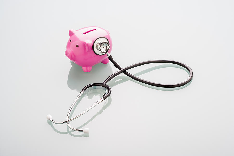 Piggy Bank Gets A Health Check-up Photograph by Nicholas Rigg Piggy Bank Gets A Health Check-up Photograph by Nicholas Rigg