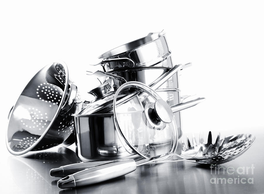 Stack with stainless steel pots and pans on white Photograph by Sandra  Cunningham - Fine Art America