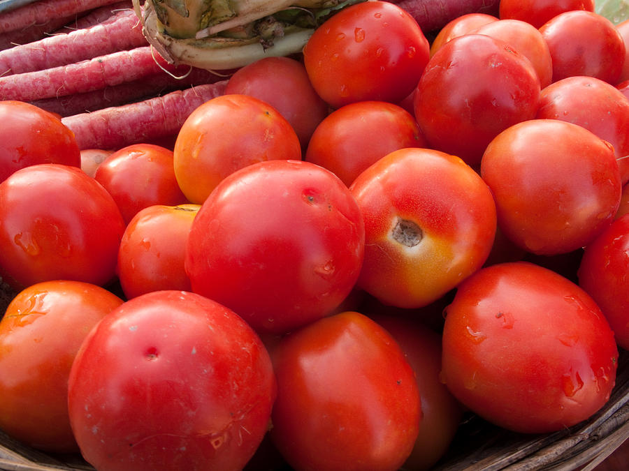 Tomato Photograph - Pile of red luscious tomatoes along with carrots on a vegetable basket by Ashish Agarwal