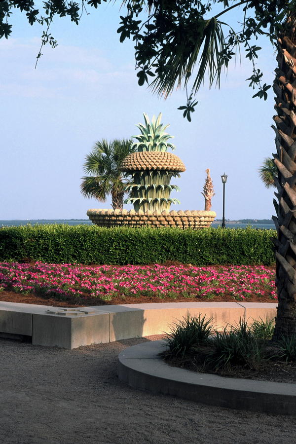 Pineapple Fountain and Flower Bed Photograph by Sally Weigand