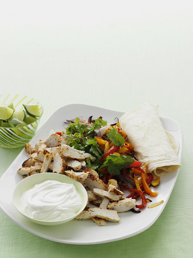 Plate Of Spicy Chicken Burrito Photograph by Cultura/BRETT STEVENS