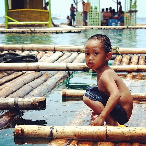 Kid Photograph - Playing On The Raft by Krystle Pagkalinawan