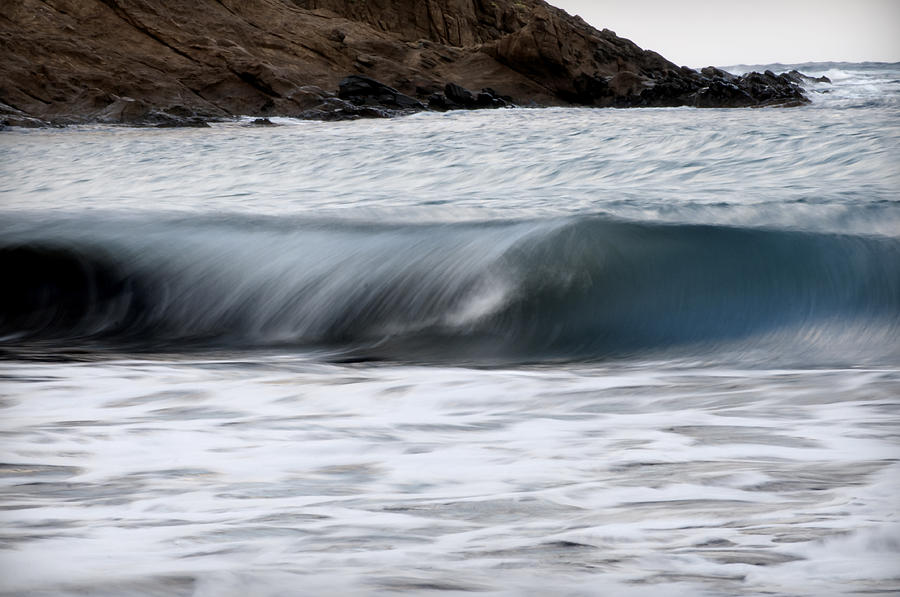 playing with waves 1 - A beautiful image of a wave rolling in noth coast of Menorca Photograph by Pedro Cardona Llambias