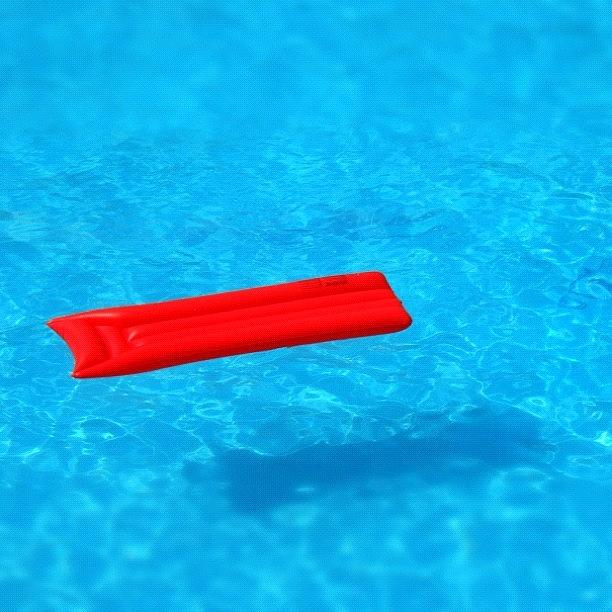 Summer Photograph - Pool - blue water and red airbed by Matthias Hauser