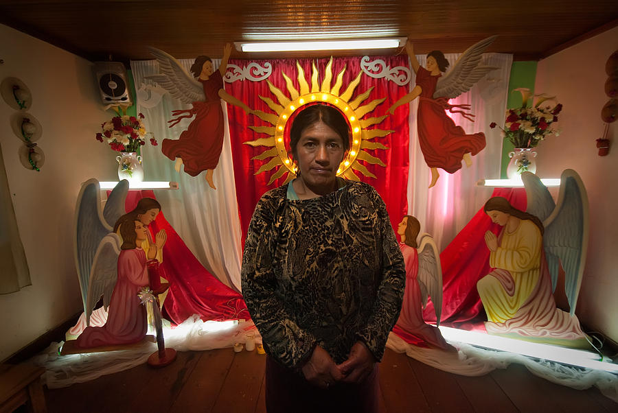 Portrait Photograph - Portrait of a woman in front of the altar of the saint of the town. Department of Narino. Republic o by Eric Bauer