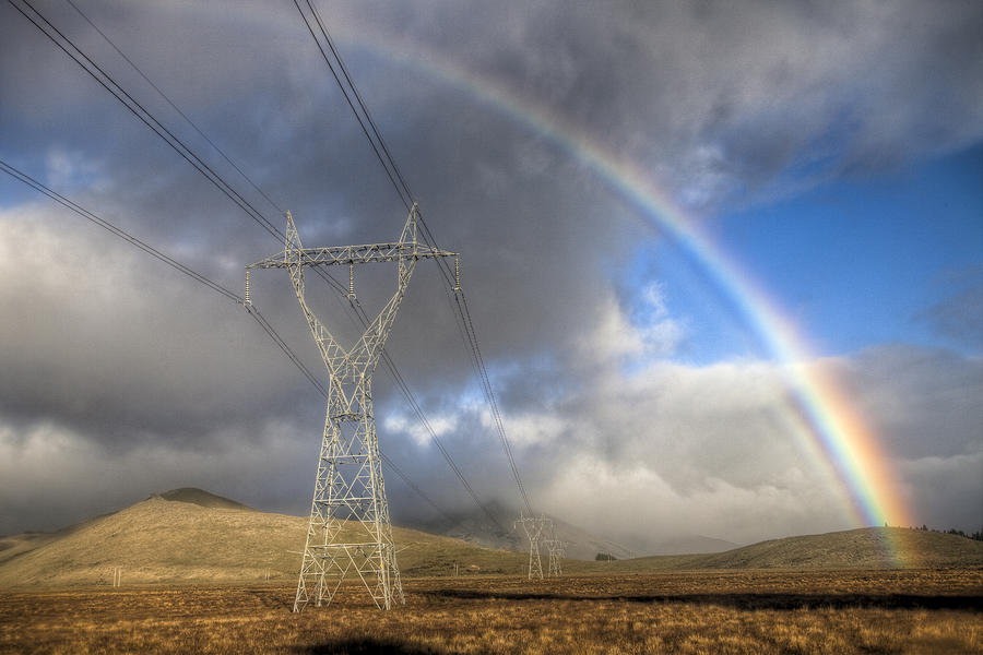 Powerlines, Rainbow Forms As Evening Photograph by Colin Monteath