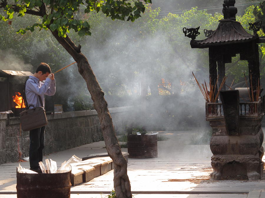 Praying At The Temple Photograph by Alfred Ng