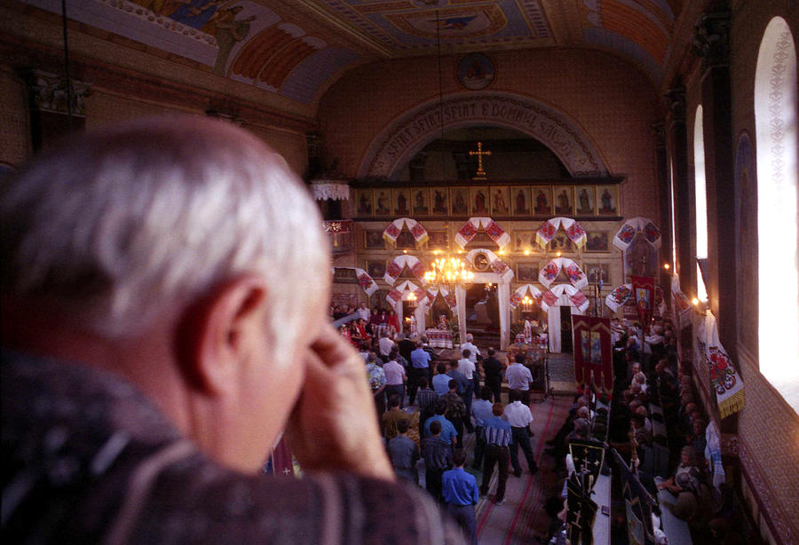 Praying in an Orthodox Church in Bistrita Romania Photograph by Emanuel Tanjala