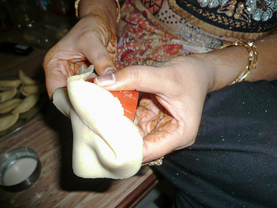 Preparing the dough for a traditional Indian Hindu sweet Photograph by Ashish Agarwal